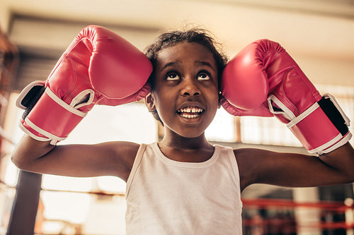 Close up of kid wearing boxing gloves