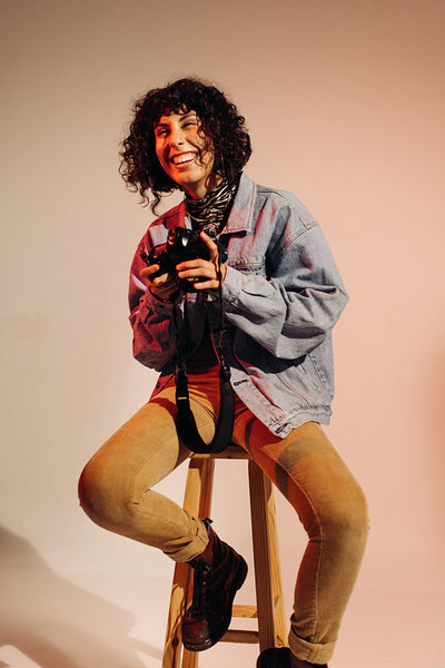 Female photographer laughing happily