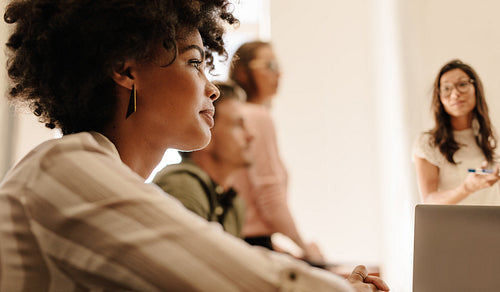 Businesswoman during presentation in board room.
