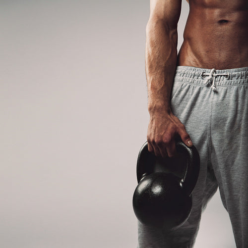 Kettlebell in young man's hand