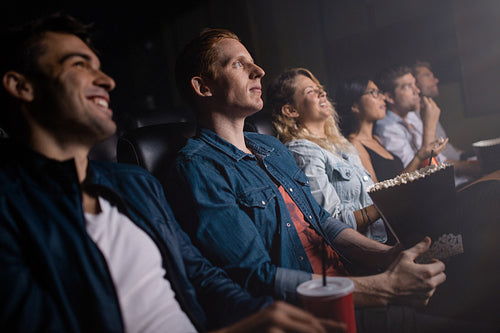 Group of people in theater watching movie