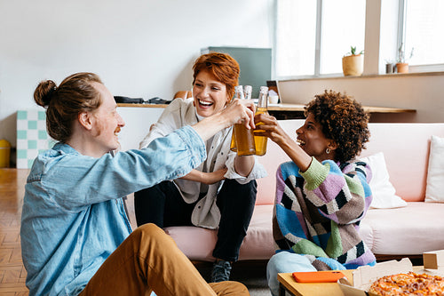 Colleagues toasting in a relaxed freelance co-working space
