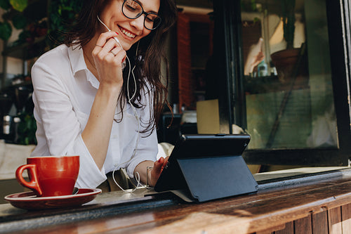 Freelancer at cafe making a video call