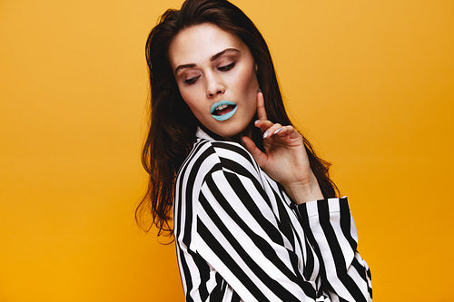 Fashionable model posing in studio