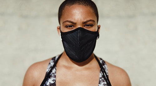 Fitness woman wearing protective face mask