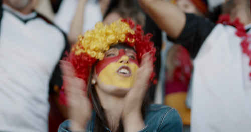 German soccer fan with crowd chanting for her national team