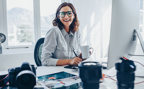 Woman photo editor at office