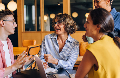 Group discussion between colleagues in a modern office setting
