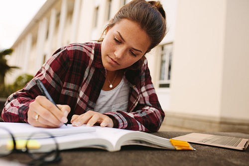 College girl studying at campus