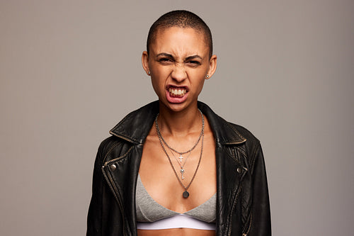 Androgynous woman growling