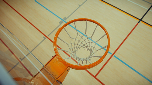 Basketball hoop view of a successful shot