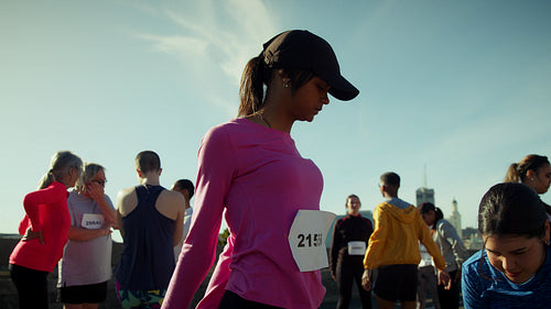 Athletes stretch before outdoor running event