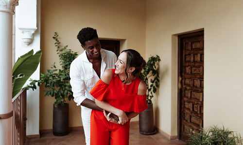 Couple having fun together outside their home