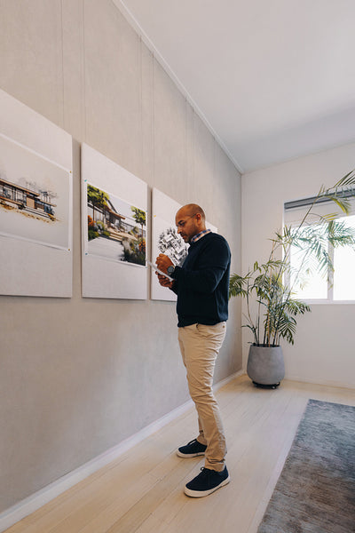Male manager reviewing architectural notes in modern office setting