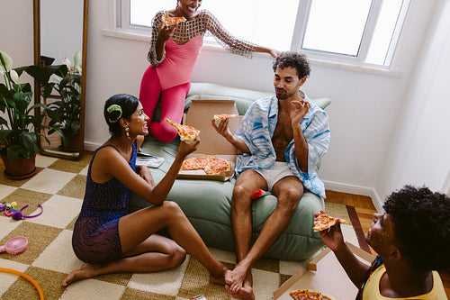 Friends pizza party indoors