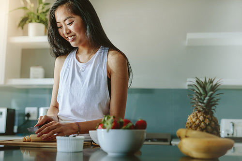 Female making healthy breakfast after workout