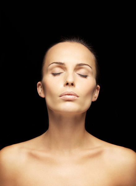 Beautiful young woman with eyes closed