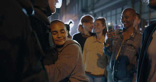 Woman hugging a policeman