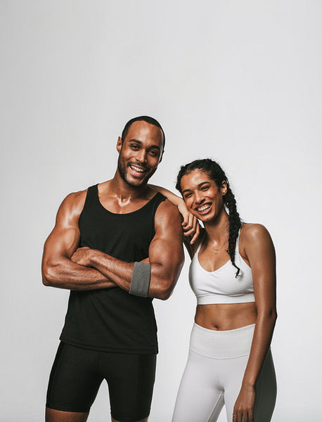 Cheerful fit couple standing together