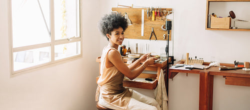 Woman artist making ornaments