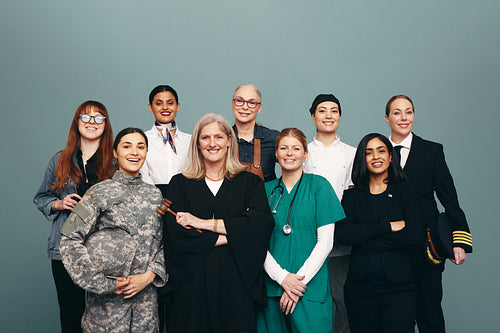 Successful female professionals smiling in a studio