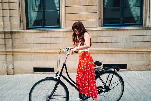Female traveller riding a bicycle
