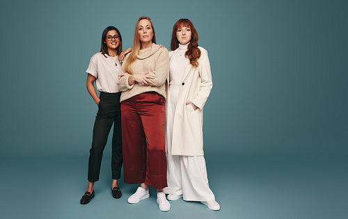 Studio shot of three women looking at the camera