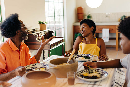 Family enjoying a traditional Brazilian meal together