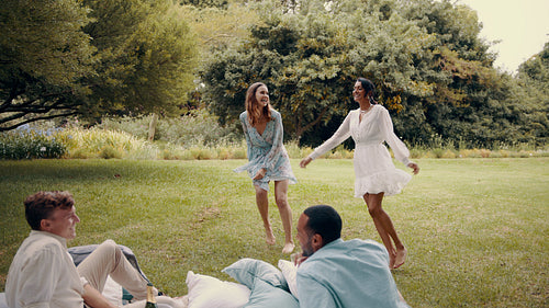 Friends enjoying a luxury picnic