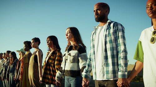 People united holding hands for change