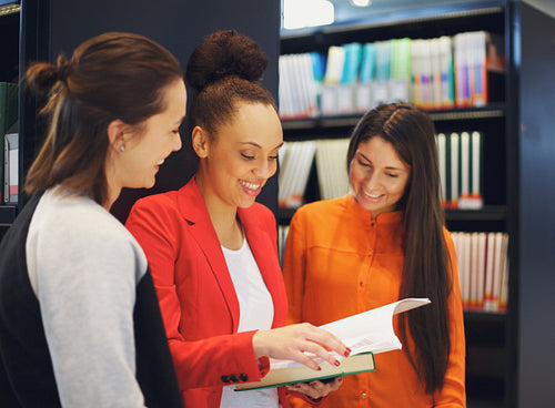 Students preparing for exams together in library
