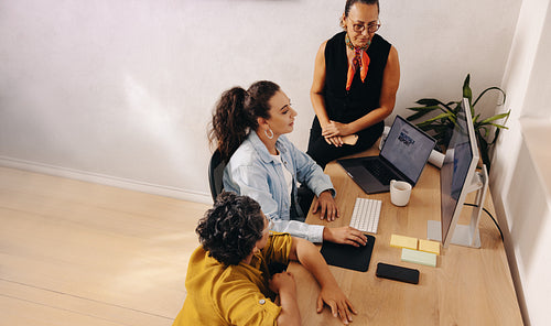 Team collaborates in a modern office creating projects with copy space elements
