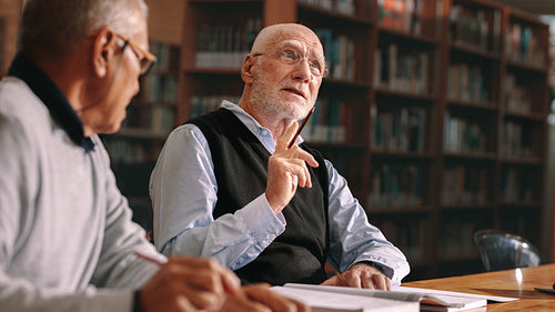 Senior colleagues discussing in college