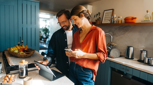Couple cooking and working at home