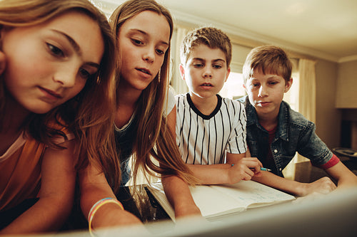Kids learning together on a computer