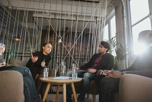 Creative young people discussing new project.