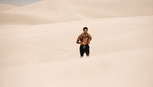 Man doing running exercising in desert