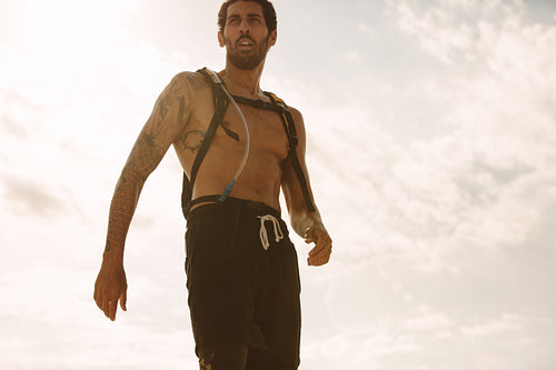 Healthy young man against sky