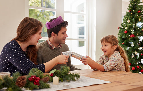 Cute little girl giving Christmas gift to her mother
