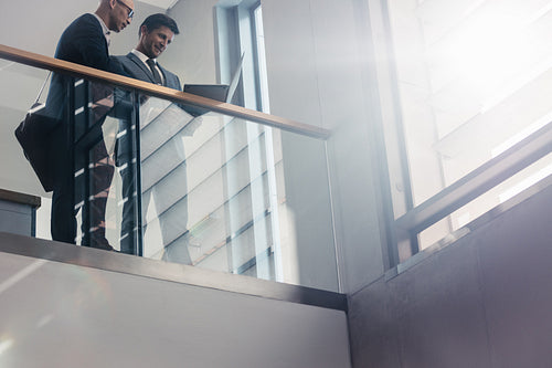 Business coworkers discussing work in office