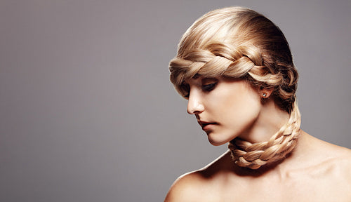 Blond woman with creative braid hairdo