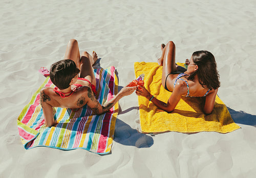 Women relaxing on beach