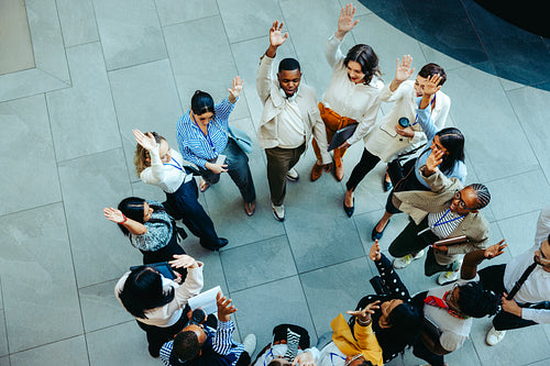 Successful business team celebrating teamwork in a corporate briefing setting