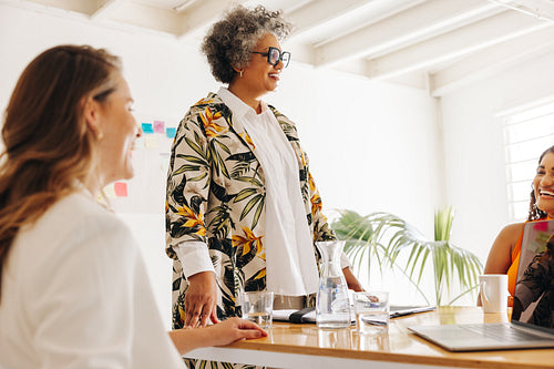 Happy businesswomen having a meeting in a boardroom