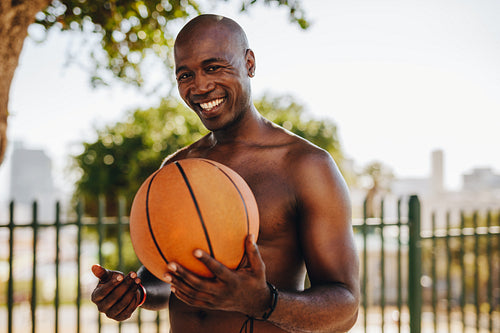 Portrait of man holding a basketball
