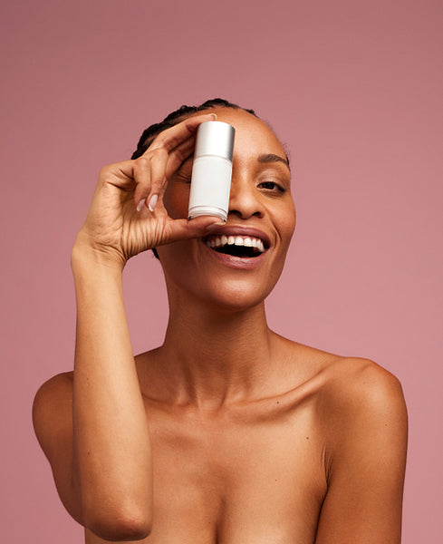 Woman holding a skincare cream