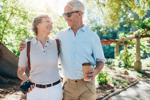Loving mature couple walking together in a park