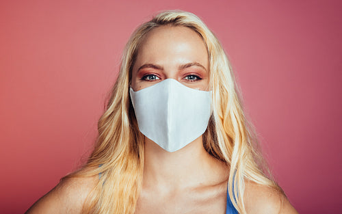 Woman wearing a face mask to prevent from corona virus