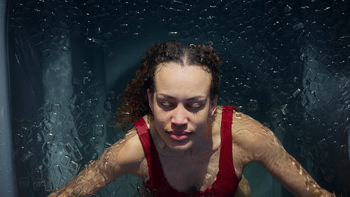 Biohacking inspires the woman in an ice bath during cold plunge recovery