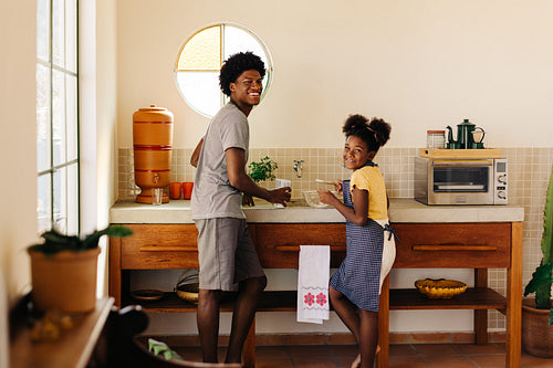 Brazilian siblings enjoy baking together in the kitchen